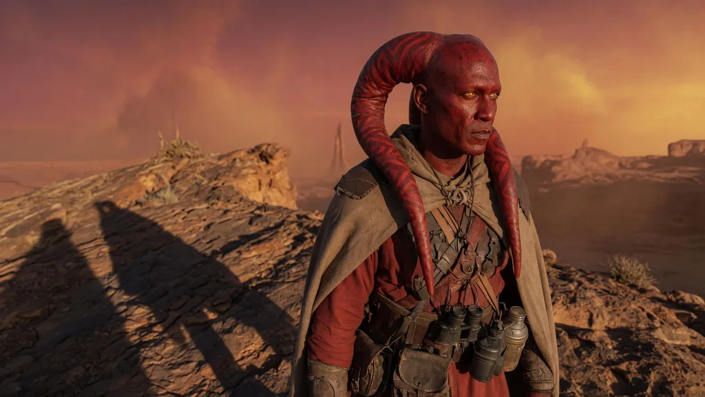 Red-skinned Lethan Twi'lek man with patterned lekku against a Ryloth sunset — artwork for the Twi'lek name generator